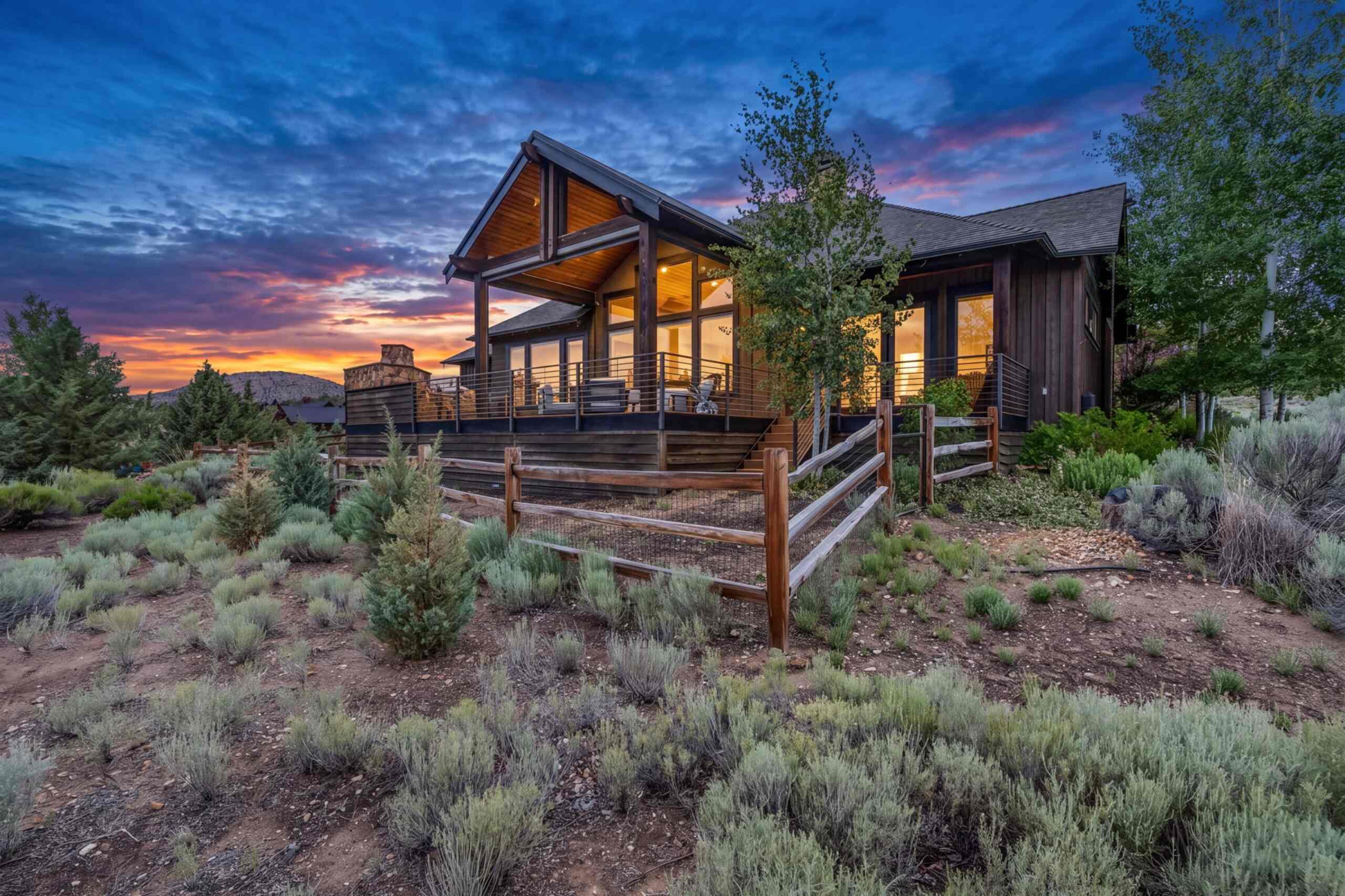 Mountain-style vacation home at sunset surrounded by high-desert sagebrush in Central Oregon